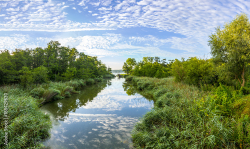 small creek flows in backwater lake of baltic sea in Pudagla