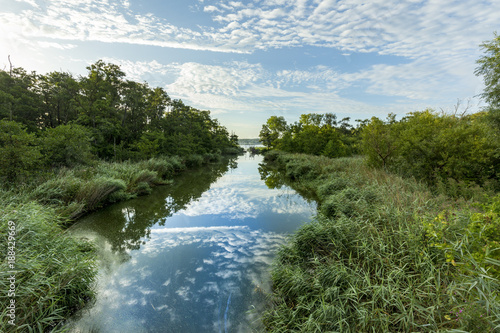 small creek flows in backwater lake of baltic sea in Pudagla