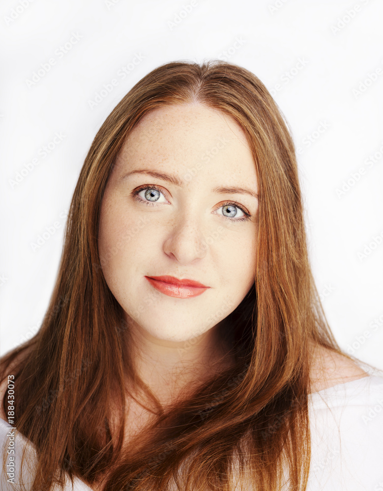 Beautiful young redhead woman with freckles portrait isolated on white Beautiful young redhead woman with freckles portrait isolated on white