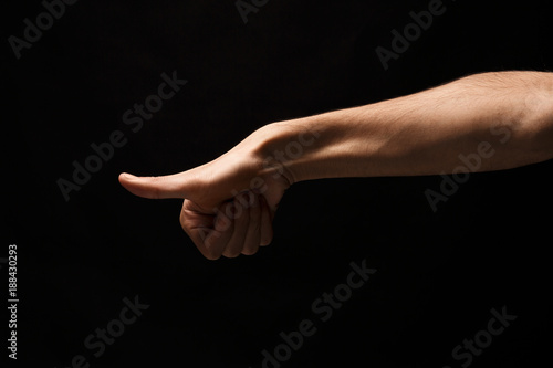 Hand gestures - man pointing, isolated at black