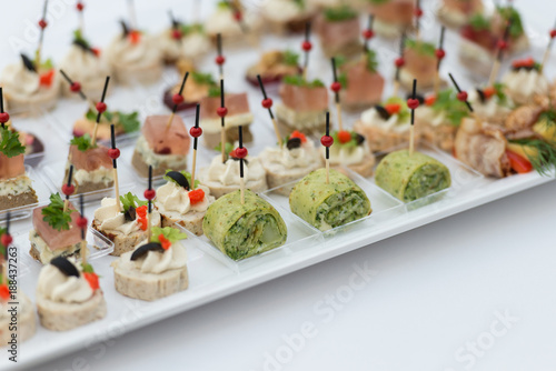 Plate full of tasty oriental  snacks.