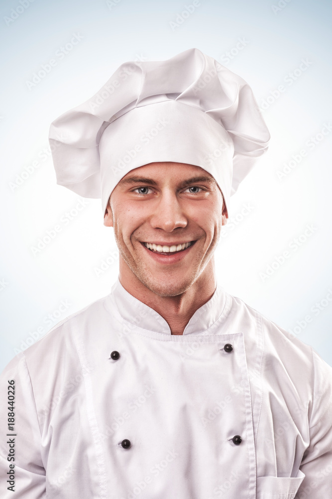 standing smiling male cook in white uniform and hat standing smiling male cook in white uniform and hat