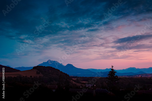 Scenic blue and pink sunset in mountains