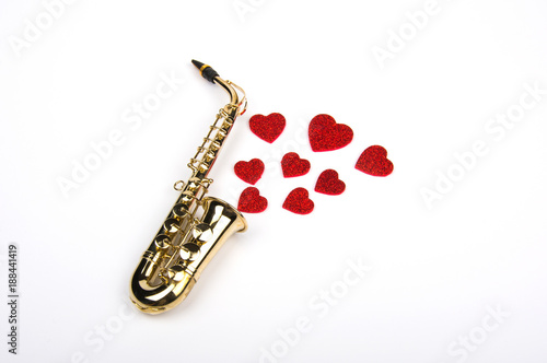 Saxophone with hearts. Flat lay, top view