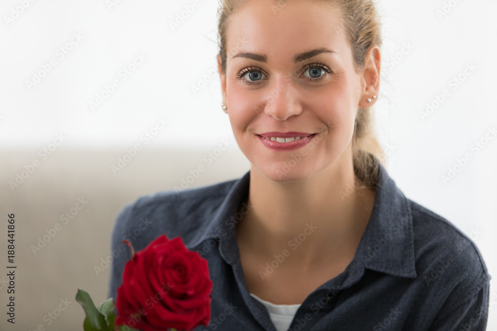 Valentine's day. Young beautiful woman receives a from her handsome boyfriend Valentine's day. Young beautiful woman receives a from her handsome boyfriend
