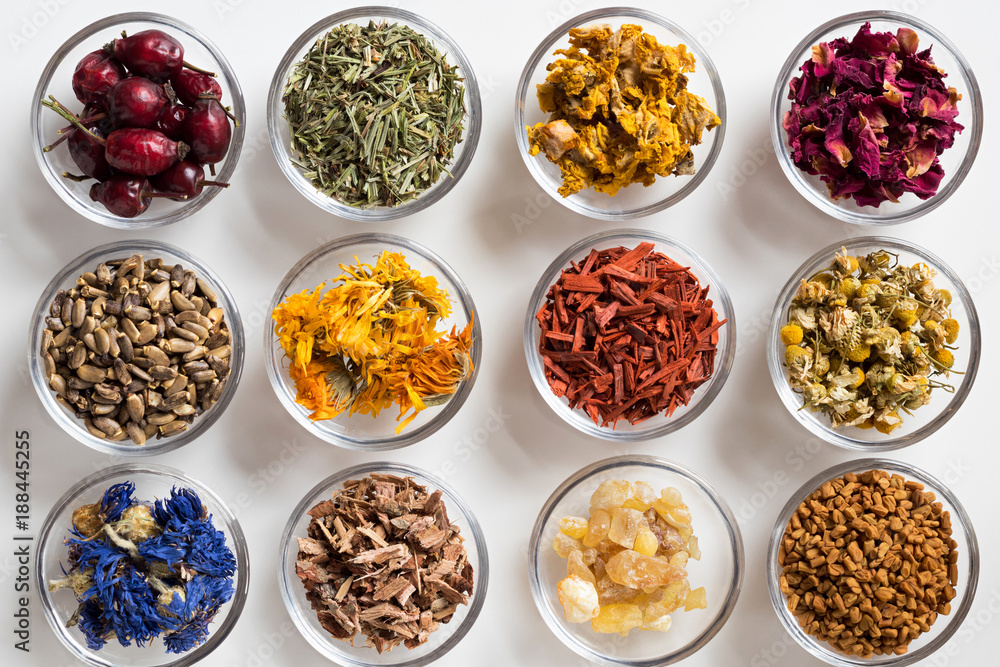Selection of dried herbs on a white background, top view Selection of dried herbs on a white background, top view