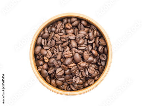 Coffee beans in a wooden bowl seen from above isolated on white background