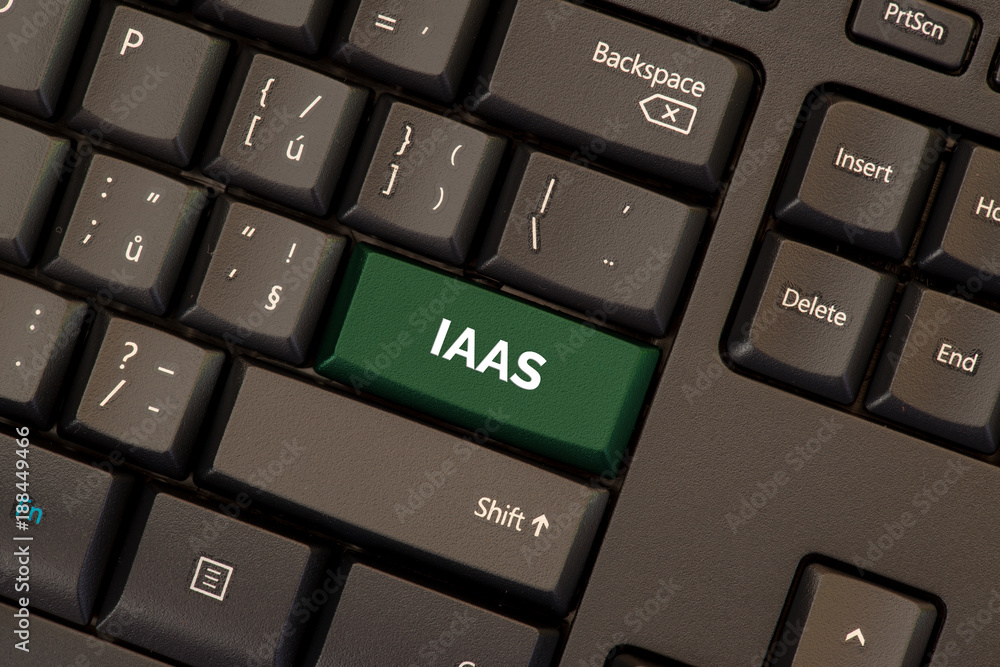 Infrastructure as a service (IAAS) concept on green button on keyboard Infrastructure as a service (IAAS) concept on green button on keyboard