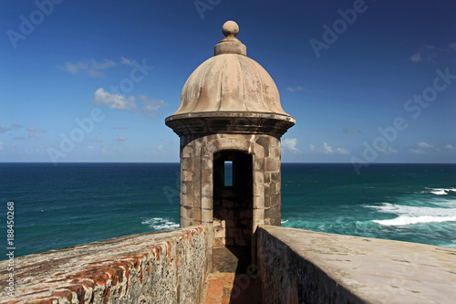 A Sentry Box of the El Morro Fortress in San Juan, Puerto Rico on a sunny Day with blue Sky and Sea