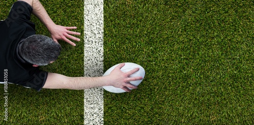 Bild auf Leinwand Composite image of a rugby player scoring a try
