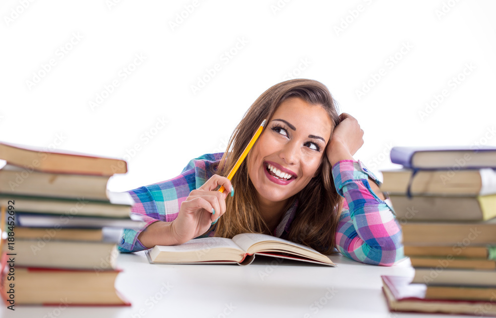 Happy student reading and thinking Happy student reading and thinking