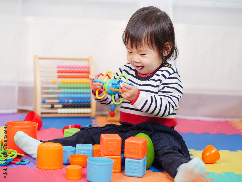 baby girl play toy at home