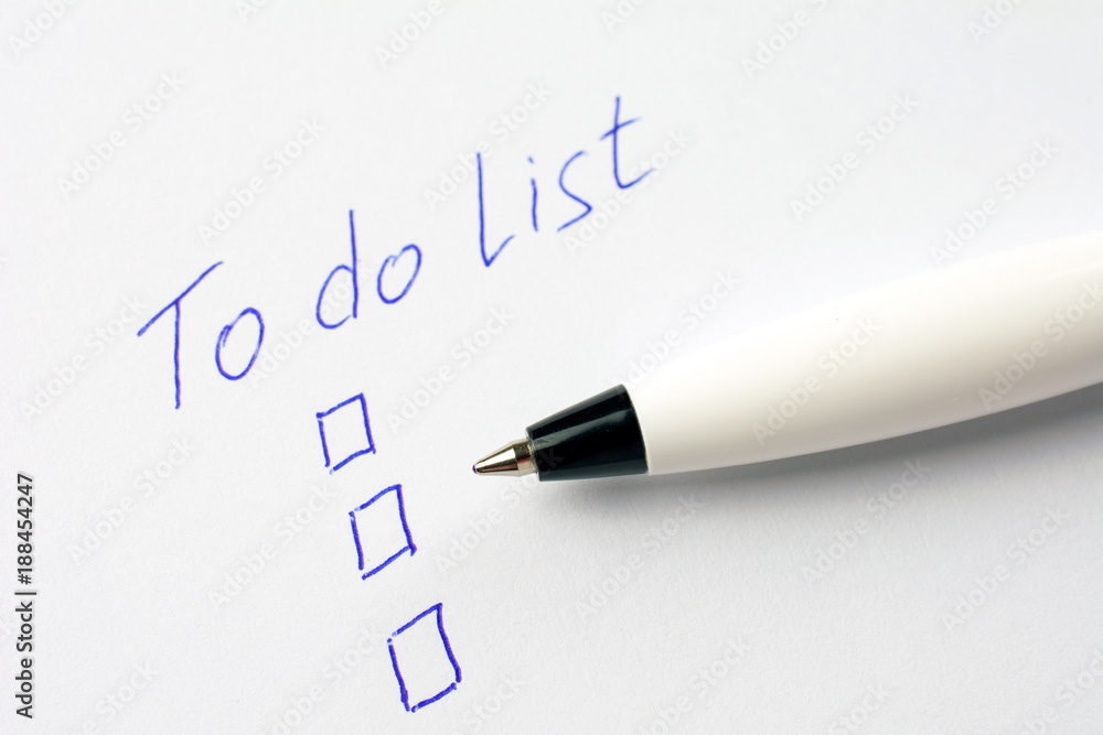 to do list on a white sheet of paper, pen notes completed check box. self management concept, close up, selective focus to do list on a white sheet of paper, pen notes completed check box. self management concept, close up, selective focus