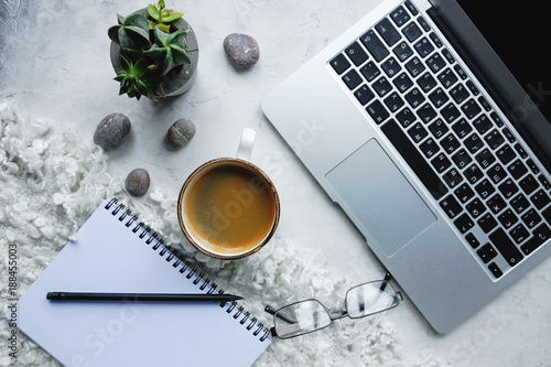 laptop computer, coffee mug, notebook and smart phone on white background