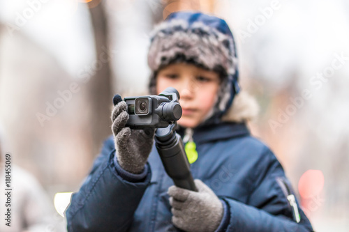 Boy with action camera in winter Vienna, Austria

