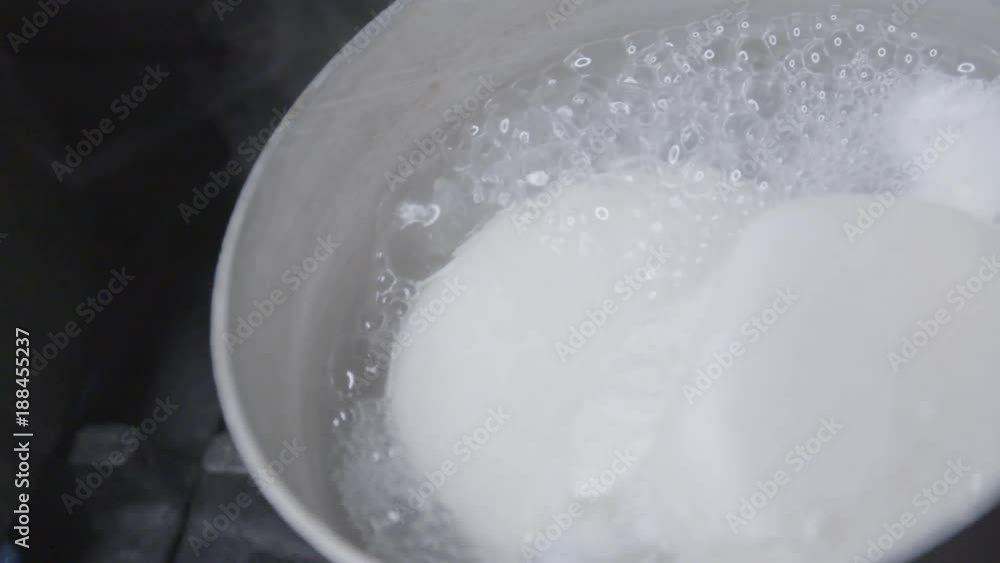 Mozzarella cooks in pot, close up Mozzarella cooks in pot, close up