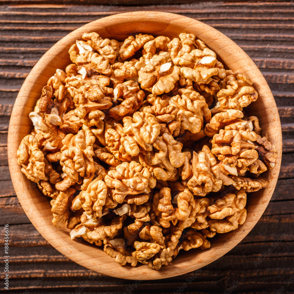 Walnut on a dark rustic wooden background Walnut on a dark rustic wooden background