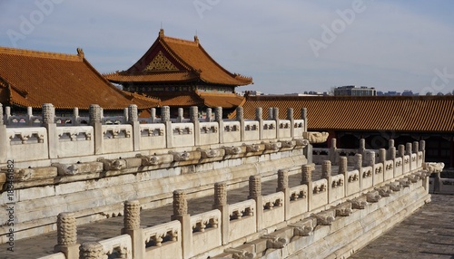 White fences and yellow roof tops in forbidden city in Beijing China