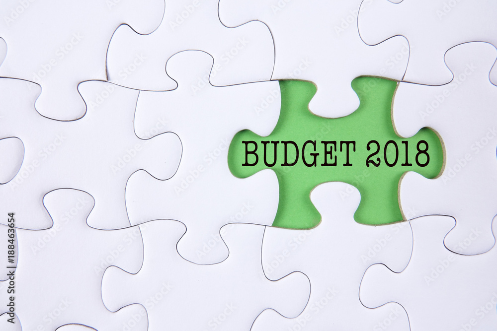 Business concept: Missing jigsaw puzzle with word BUDGET 2018. Business concept: Missing jigsaw puzzle with word BUDGET 2018.