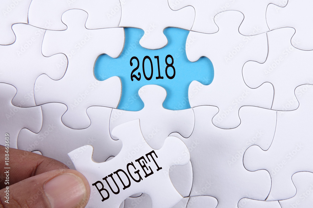 Fototapeta premium Business concept: Missing jigsaw puzzle with word BUDGET 2018.