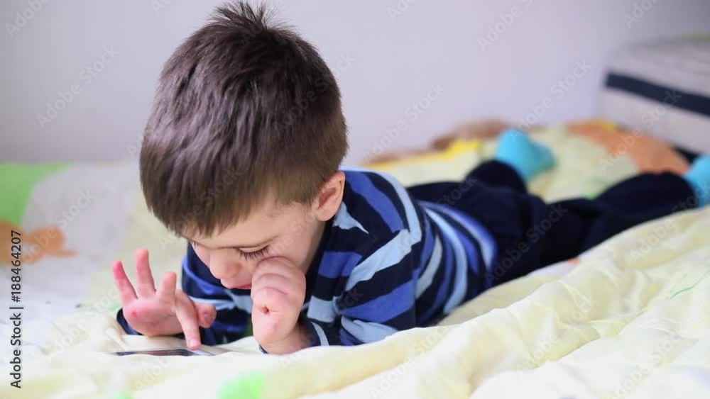Boy playing on tablet, indoor Boy playing on tablet, indoor