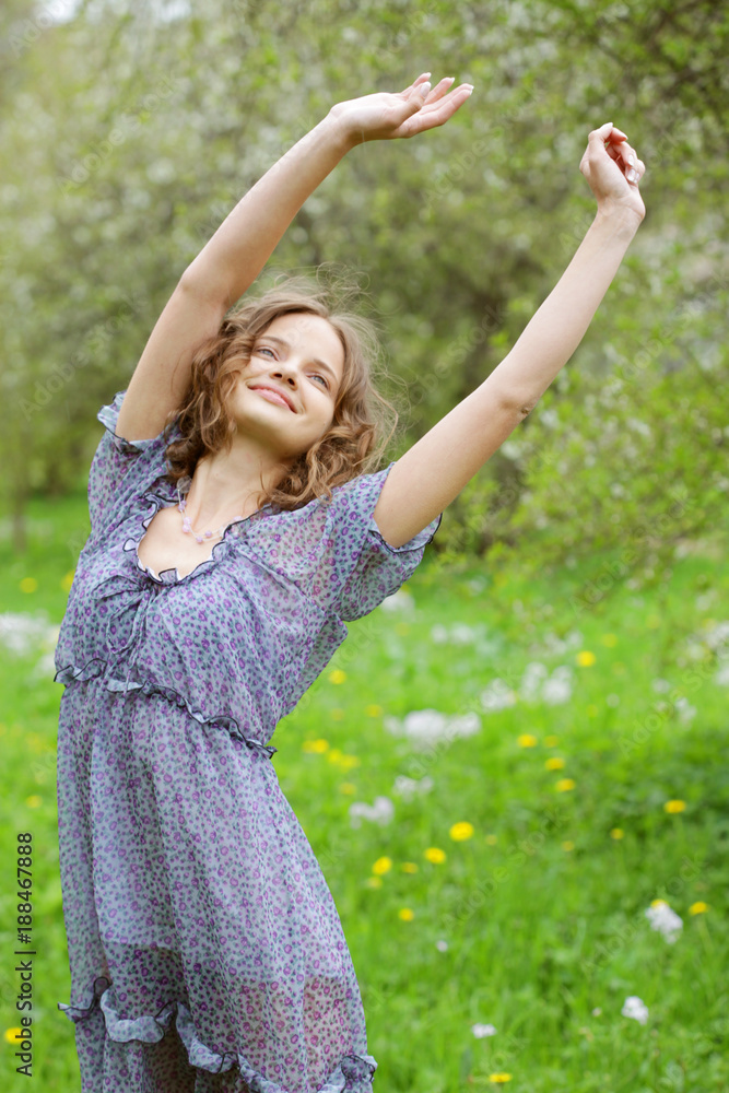 young woman in dress relaxing in garden young woman in dress relaxing in garden