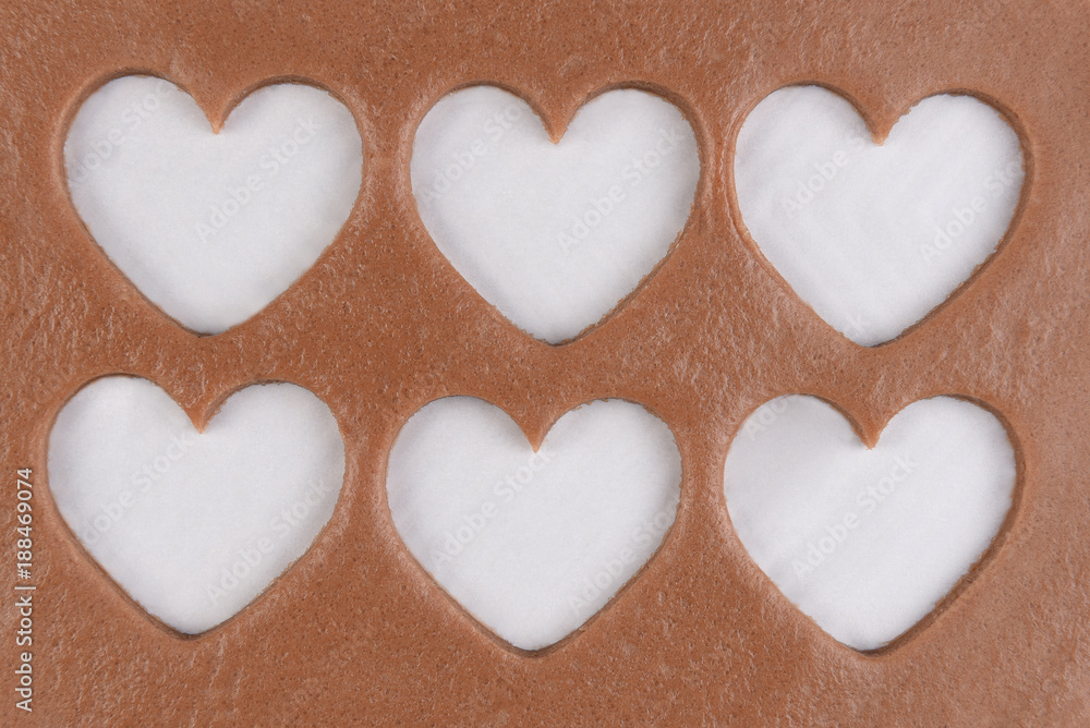 Fototapeta premium Six heart shapes cut out of dough