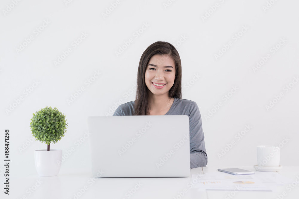 New generation asians business woman using laptop,Asian women sitting smiling while working on mobile office concept New generation asians business woman using laptop,Asian women sitting smiling while working on mobile office concept