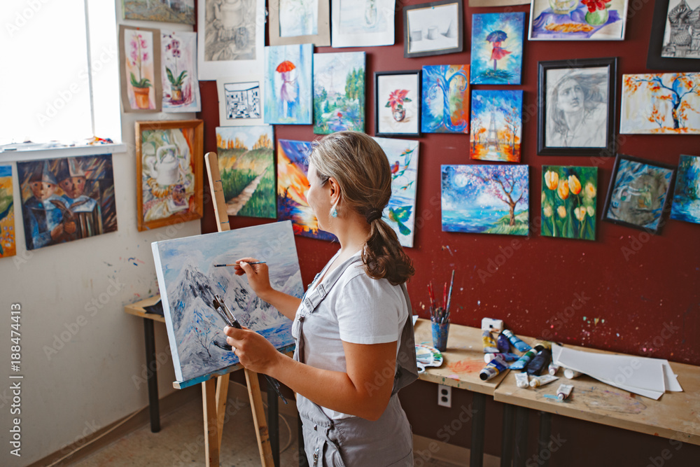 Young Caucasian People In An Art Gallery Looking At Paintings And Talking  About Them Stock Photo, Picture and Royalty Free Image. Image 22573792.