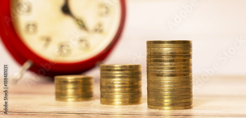 Web banner of time to savings concept - money coins with alarm clock