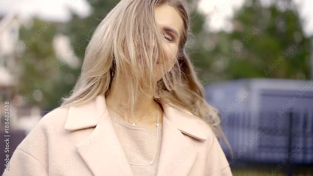 portrait of a beautiful girl, her hair fluttering in the wind portrait of a beautiful girl, her hair fluttering in the wind