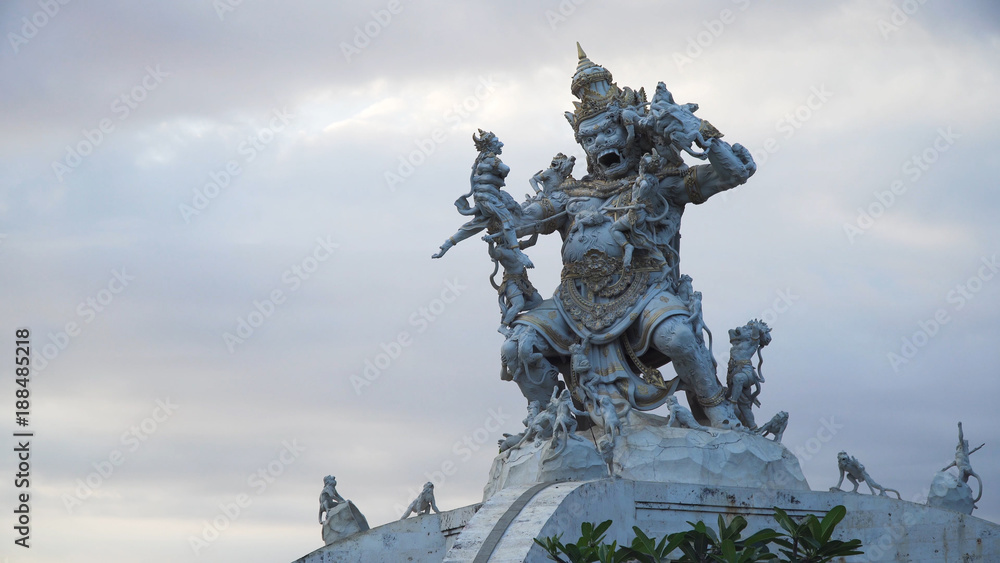Statue of God fighting with monkeys in Pura Luhur Uluwatu, Bali. Monkey god sculpture at Pura Luhur Temple. Traditional Hindu temple, old hindu architecture, Bali Architecture, Ancient design. Travel