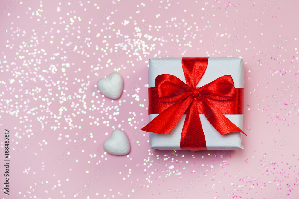 gift box vith red bow and glitter sparkles on pink background. st. Valentine's day concept gift box vith red bow and glitter sparkles on pink background. st. Valentine's day concept