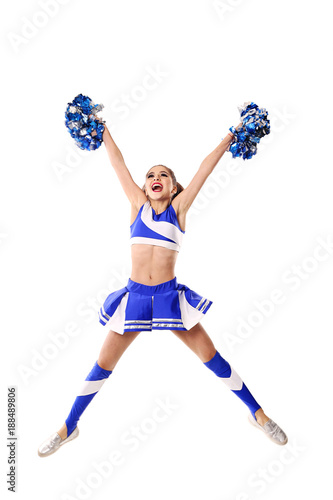 Young cheerleader in blue and white suit with pompoms on white background. Isolated on white background.