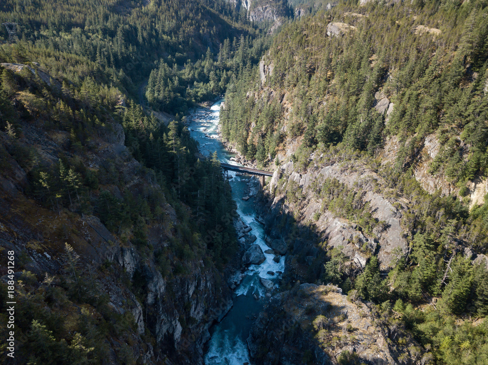 Aerial drone view of the beautiful canyon in the Canadian Landscape during a vibrant sunny summer day. Taken in Cheakamus, near Whistler, North of Vancouver, BC, Canada.
