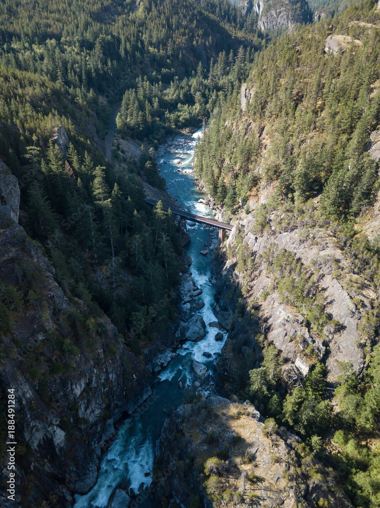 Aerial drone view of the beautiful canyon in the Canadian Landscape during a vibrant sunny summer day. Taken in Cheakamus, near Whistler, North of Vancouver, BC, Canada.
