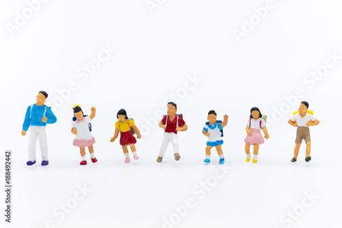 Miniature people: Group of children on white background. Image use for education, preparing for opening day of study.