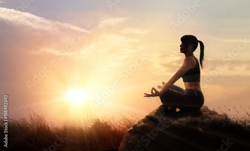 Woman meditating yoga in sunset mountains with nature. Outdoor sport exercise and relaxation concept