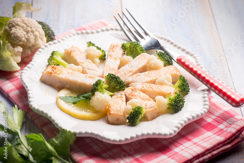 swordfish with broccoli and cauliflower salad, selective focus