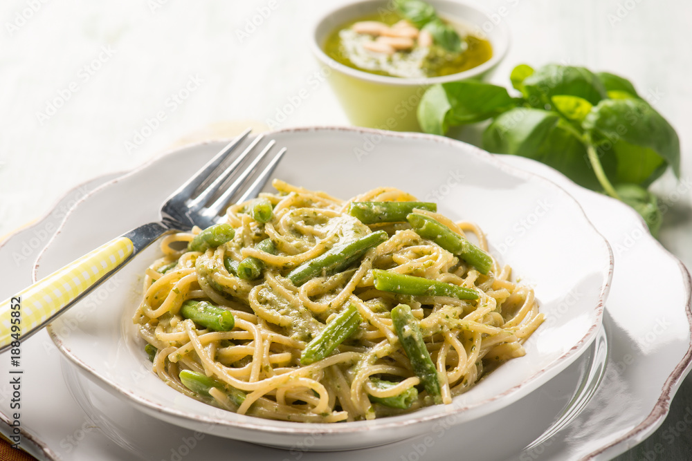spaghetti with green beans and pesto sauce, selective focus