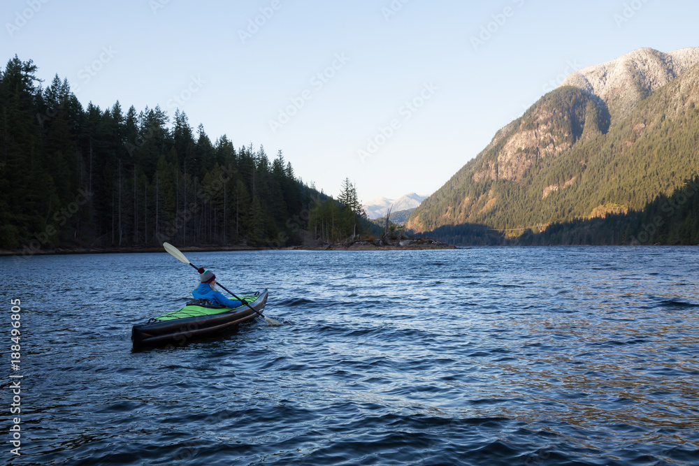 Girl Kayaking in a Lake. Taken in Buntzen Lake, Vancouver, British Columbia, Canada.