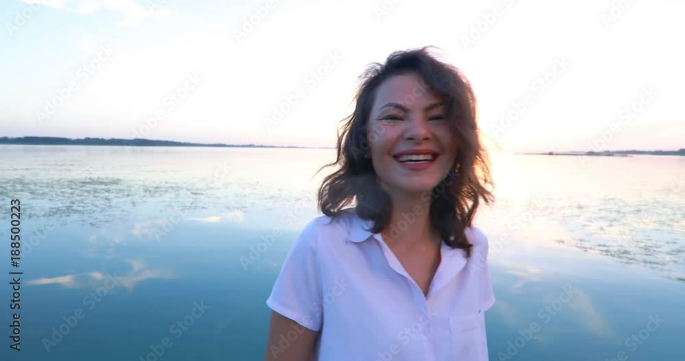 Woman at the pier by the river