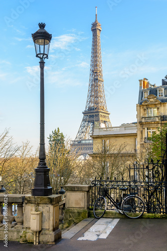 View of the Eiffel Tower from a small dead-end street of the Chaillot hill by a sunny winter afternoon. © olrat