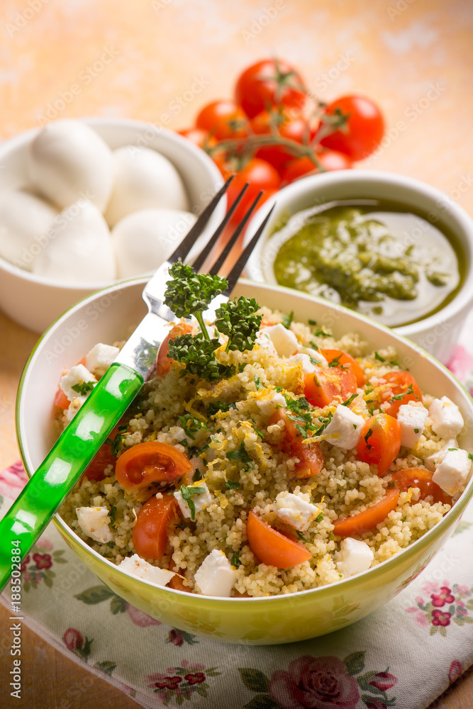 couscous with mozzarella tomatoes and pesto sauce, selective focus couscous with mozzarella tomatoes and pesto sauce, selective focus