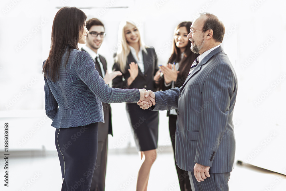 handshake of business partners after signing the contract handshake of business partners after signing the contract
