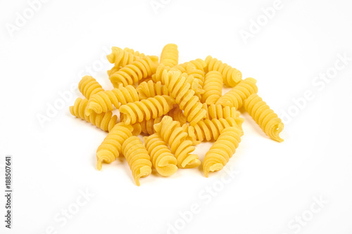 uncooked fusilli pasta noodles isolated on white background photo