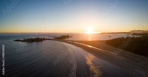 Aerial panoramic seascape view of the Beautiful Beach on Pacific Coast during a vibrant sunny summer sunset. Taken near Tofino, Vancouver Island, British Columbia, Canada.