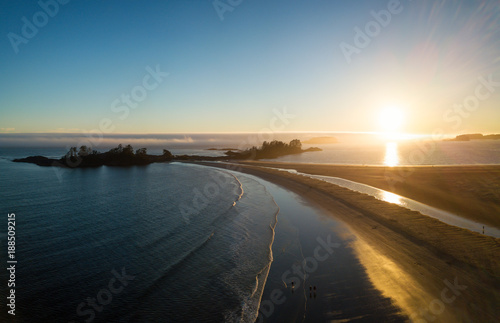 Aerial panoramic view of the beautiful Pacific Ocean Coast during a vibrant summer sunset. Taken near Tofino, Vancouver Island, British Columbia, Canada. 