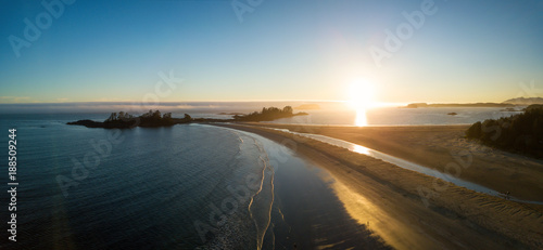 Aerial panoramic view of the beautiful Pacific Ocean Coast during a vibrant summer sunset. Taken near Tofino, Vancouver Island, British Columbia, Canada. 