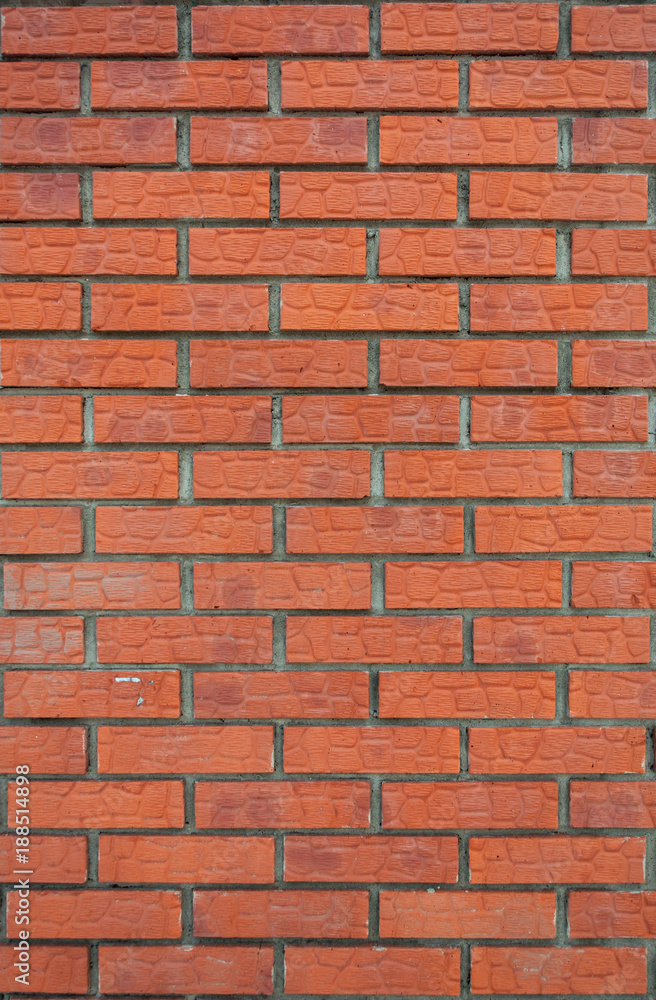 The vertical texture of the brick facade of the new red brick. The vertical texture of the brick facade of the new red brick.